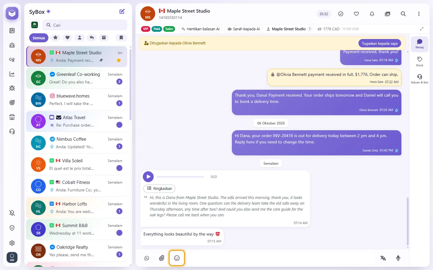 The emoji button next to the message box