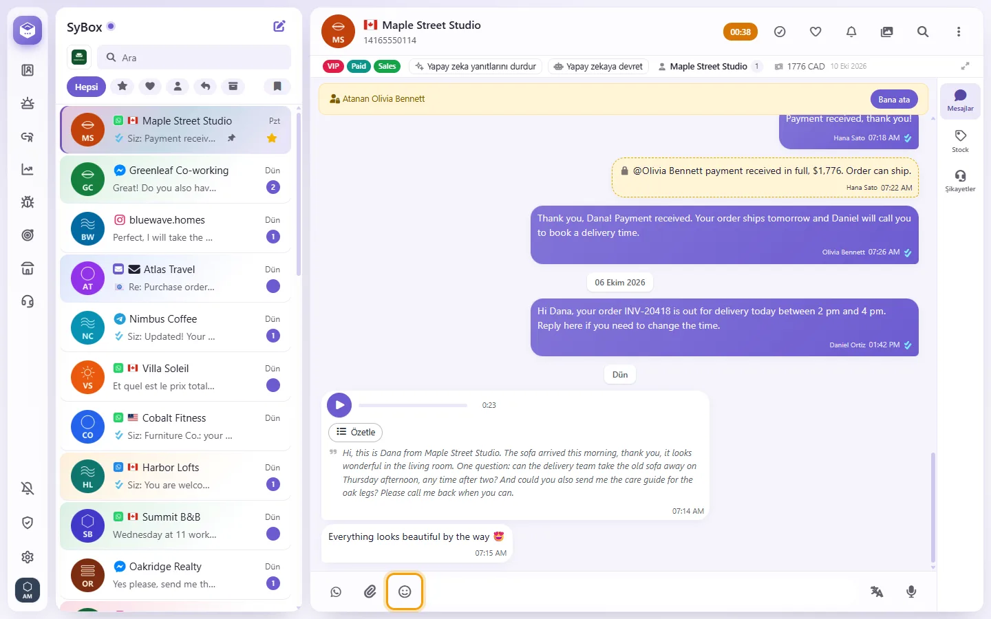 The emoji button next to the message box